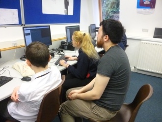 3rd Year DIT Computer Science students from Kevin Street help TY students programme in Python Photo: Ms. O'Kelly
