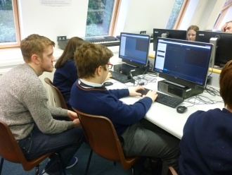3rd Year DIT Computer Science students from Kevin Street help TY students programme in Python Photo: Ms. O'Kelly
