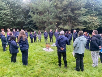 Group circle around the campfire Calling and Departure Ceremony 
